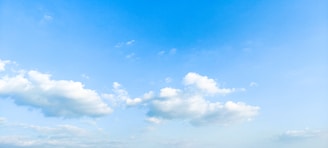 A serene cloudscape with a bright blue sky.