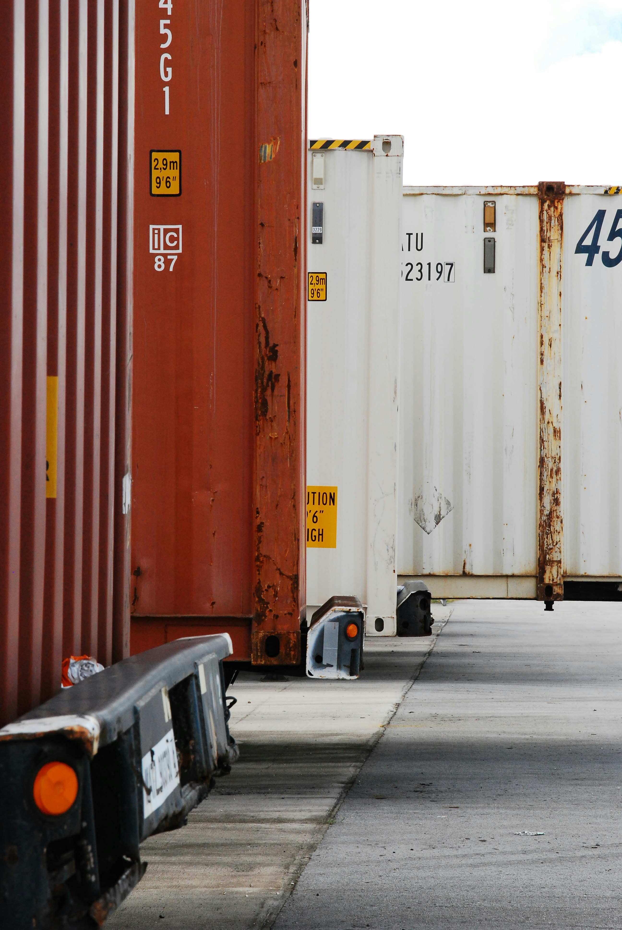 black car parked beside red and white wall