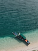 Traditional longtail boat anchored near the Similan Islands shore