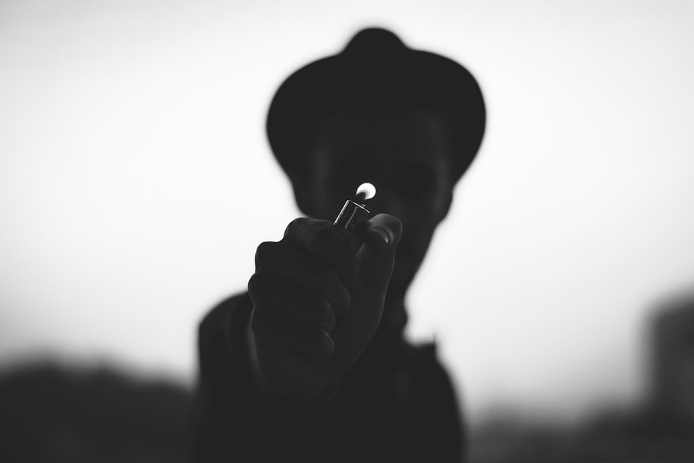 silhouette of man smoking cigarette