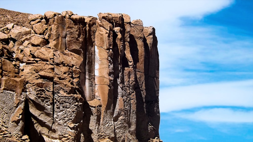 brown rocky mountain under blue sky during daytime