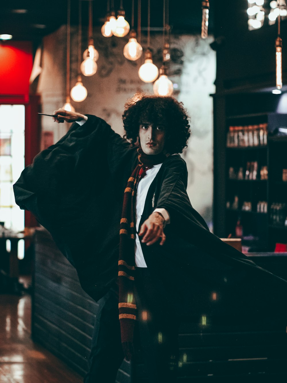 man in black jacket playing guitar