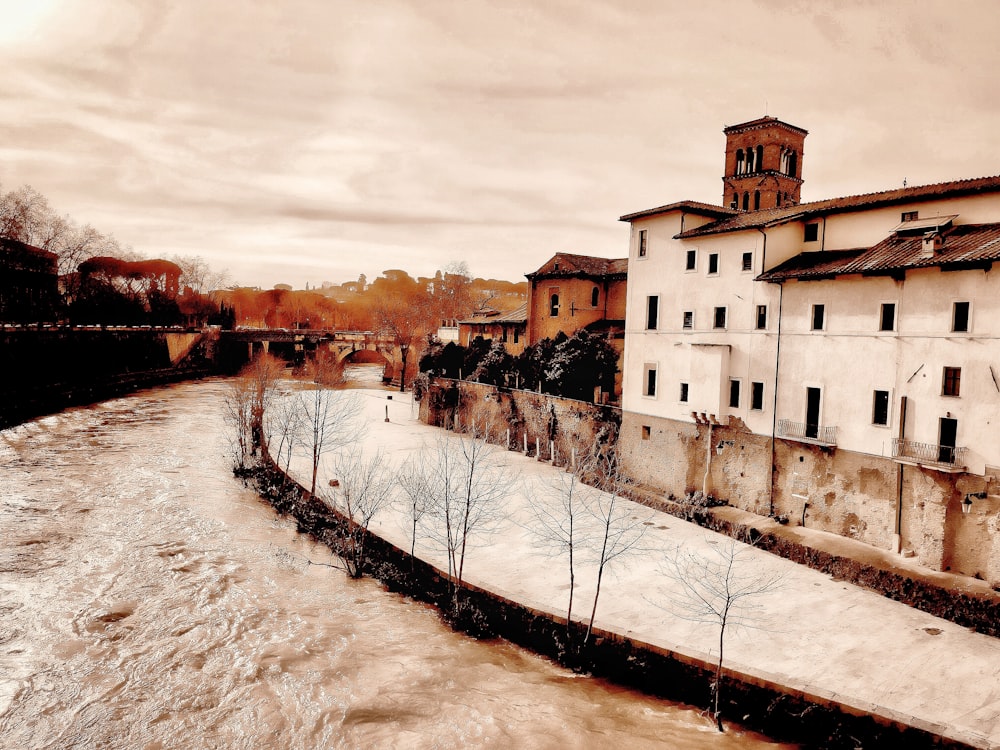 a river running through a city next to tall buildings