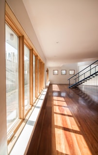 brown wooden parquet floor with glass windows