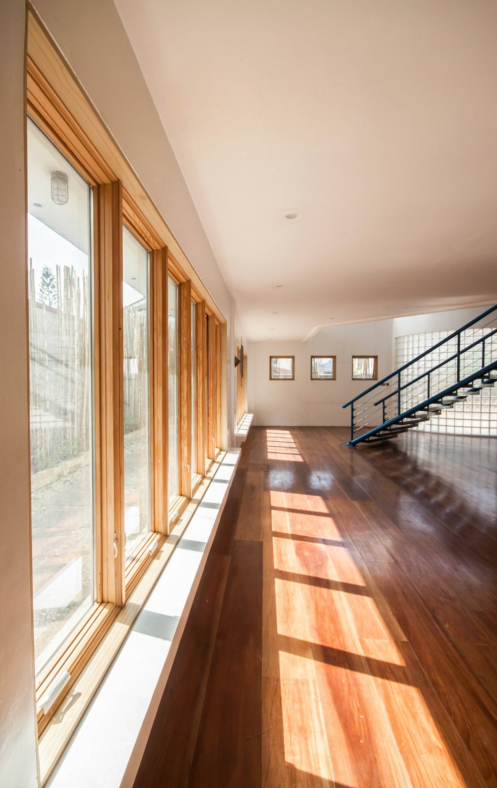 brown wooden parquet floor with glass windows