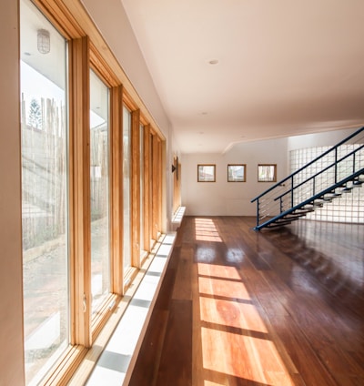 brown wooden parquet floor with glass windows