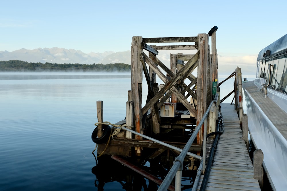 brown wooden dock on body of water during daytime