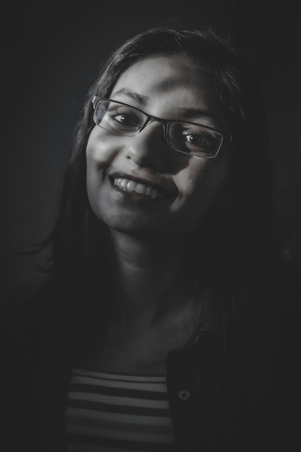 woman wearing black framed eyeglasses