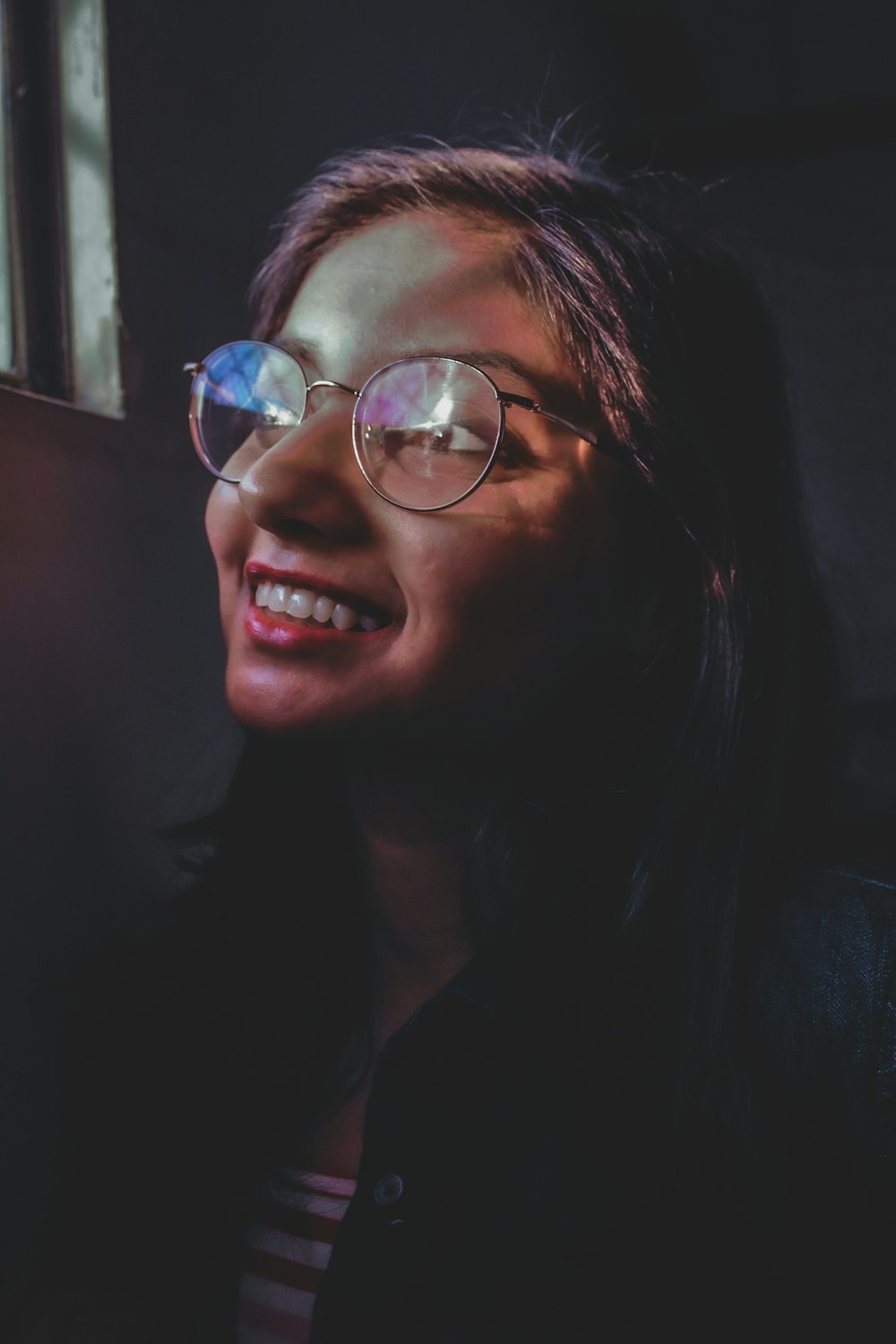 woman wearing silver framed eyeglasses