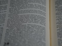 Close-up of hands flipping through the pages of the concise 30-page exam guide.