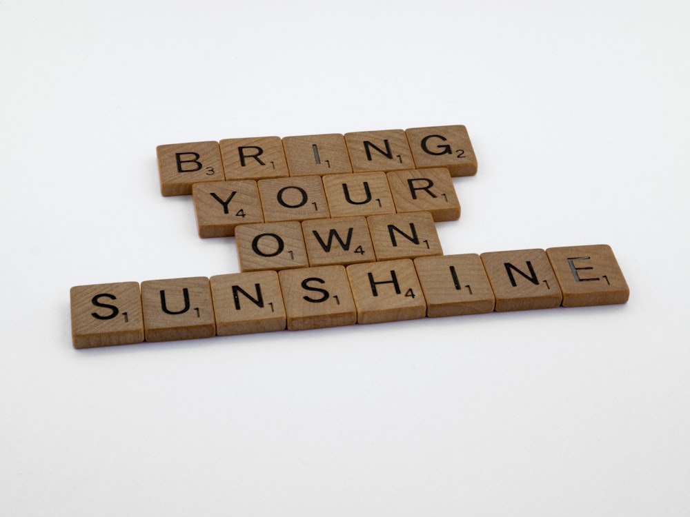 brown wooden puzzle piece on white surface