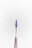 A small tool with a pointed, dark purple tip is centered against a plain light background. The handle is metallic, tapering down towards the tool's sharp end.