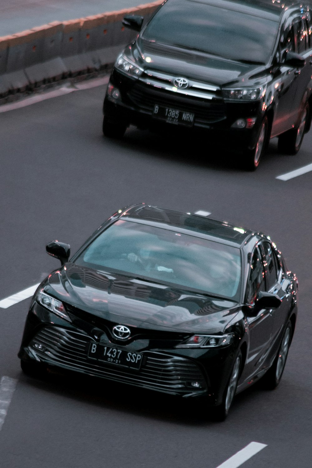 black mercedes benz c class on road during daytime