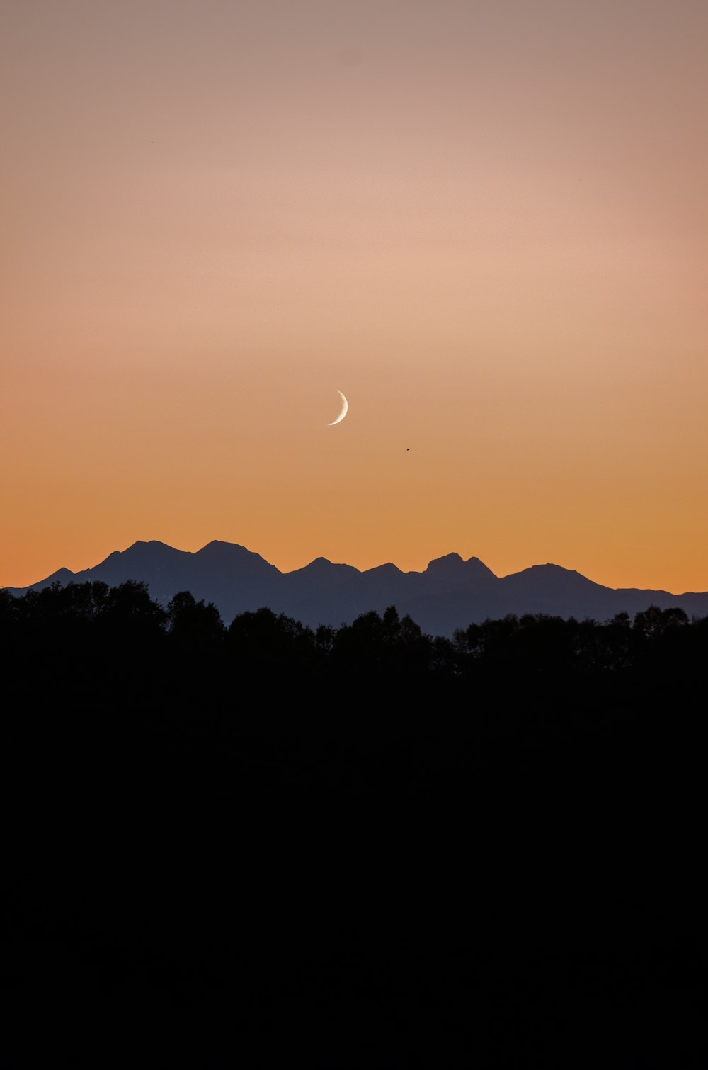 silhouette of mountain during sunset