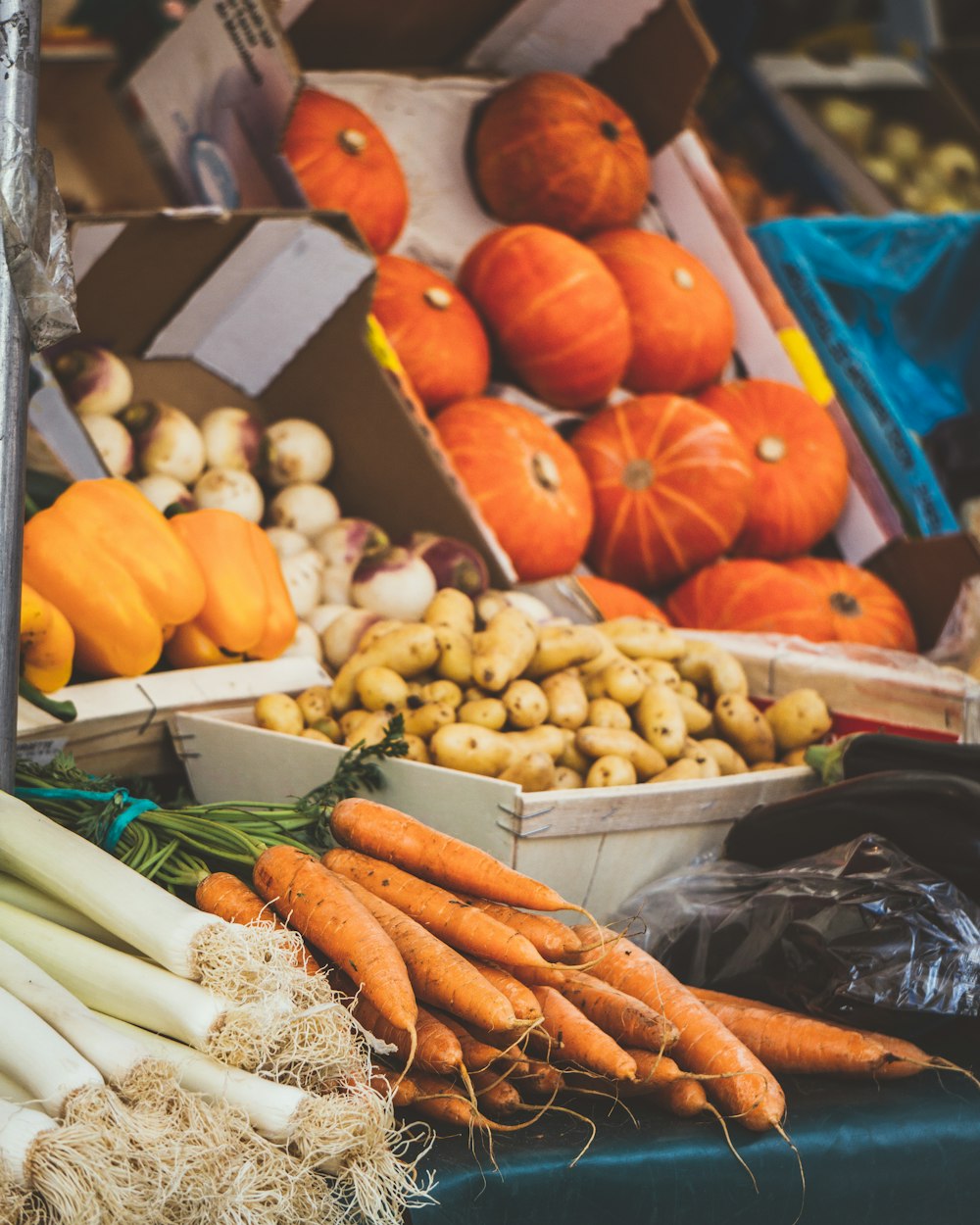 orange carrots and white garlic in a market