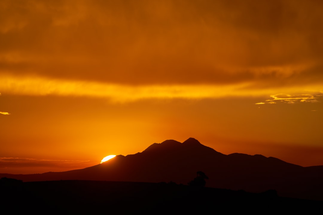 silhouette of mountains during sunset