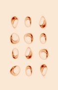 silver and gold rings on white background