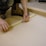 A skilled contractor measuring wood for a home renovation project.