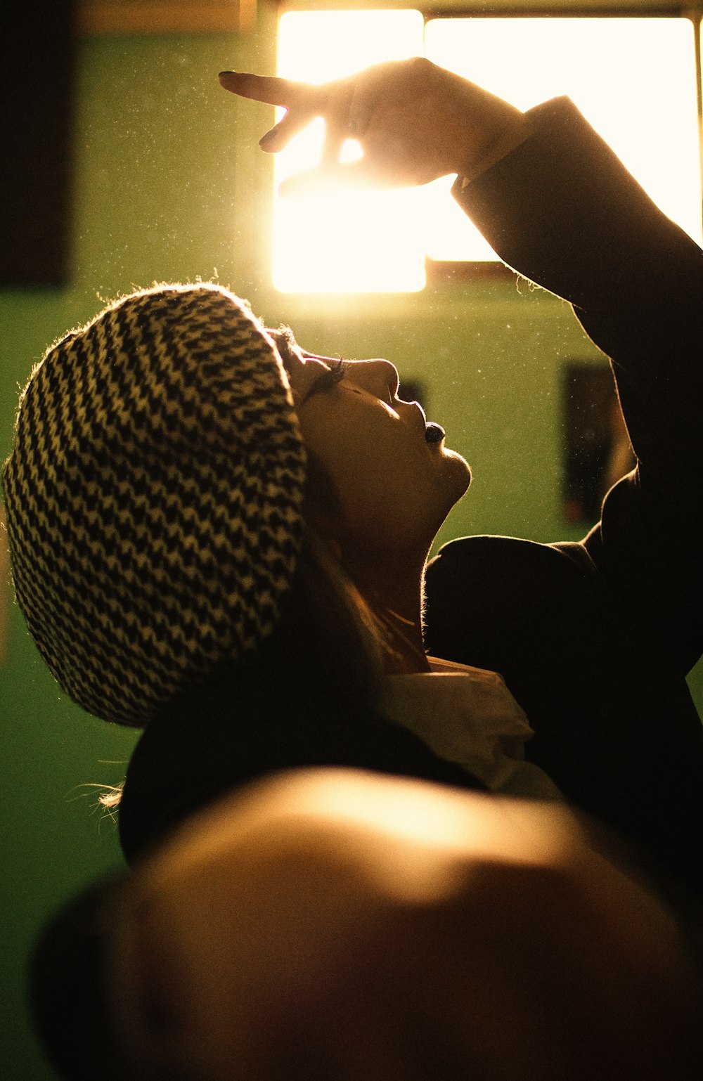 woman in black and white knit cap