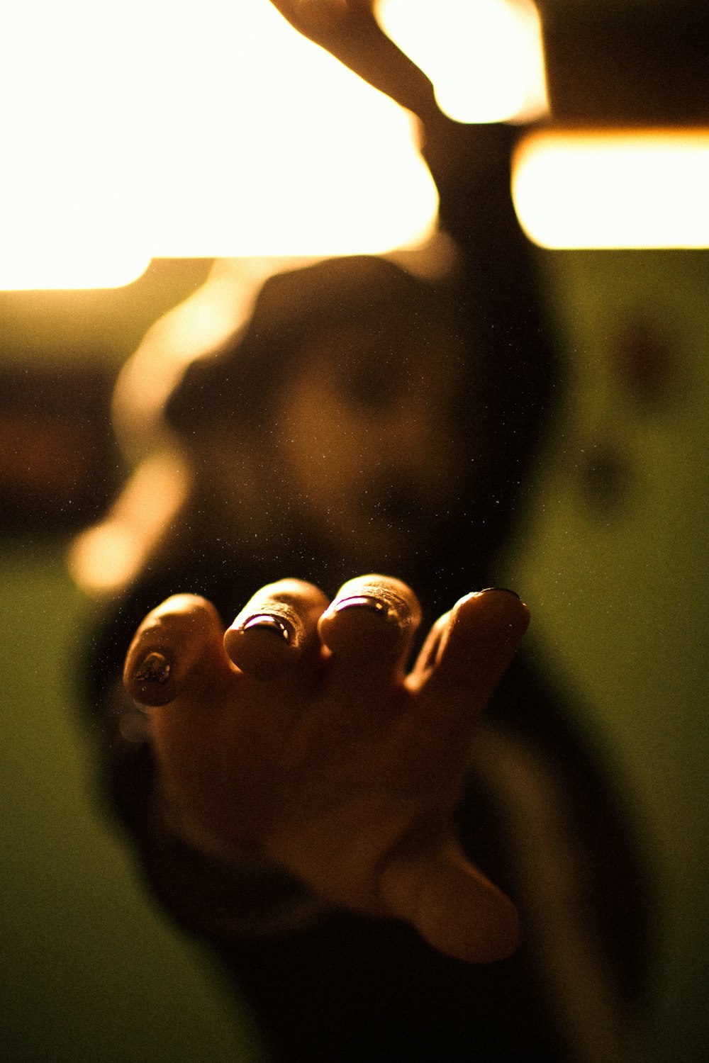 persons hand with silver ring