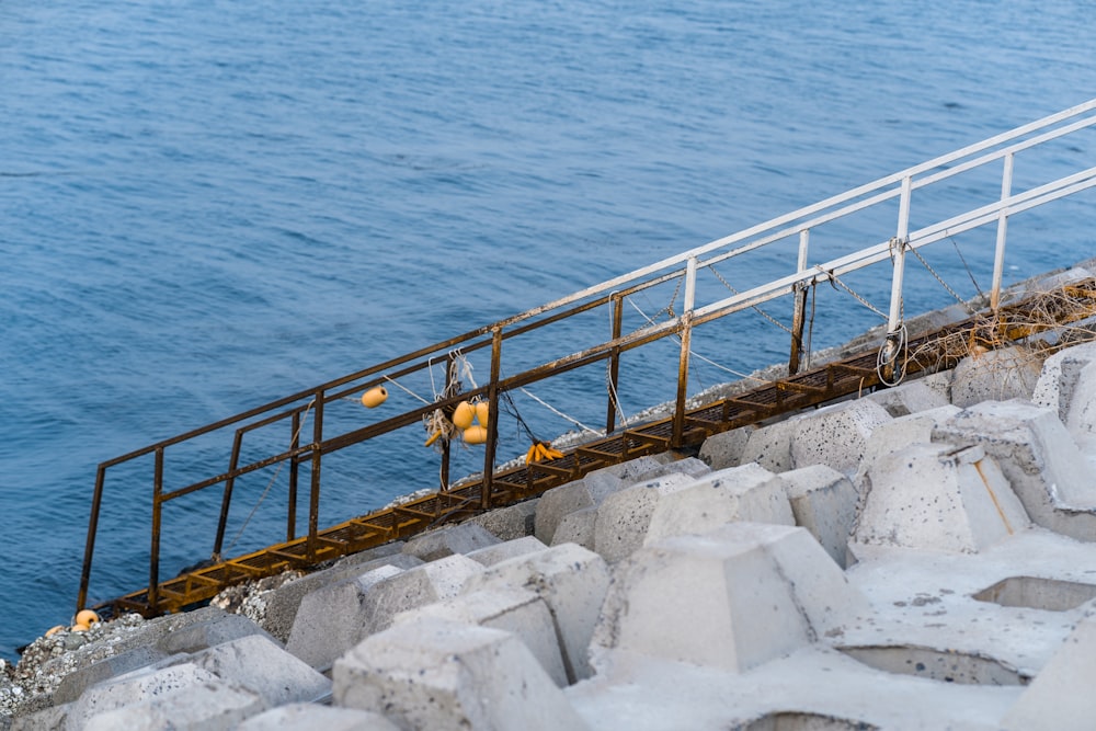 brown wooden dock on blue sea during daytime