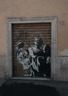 man in black and white long sleeve shirt and pants holding a baby in black and