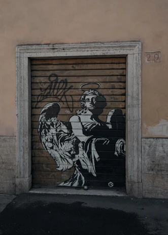 man in black and white long sleeve shirt and pants holding a baby in black and