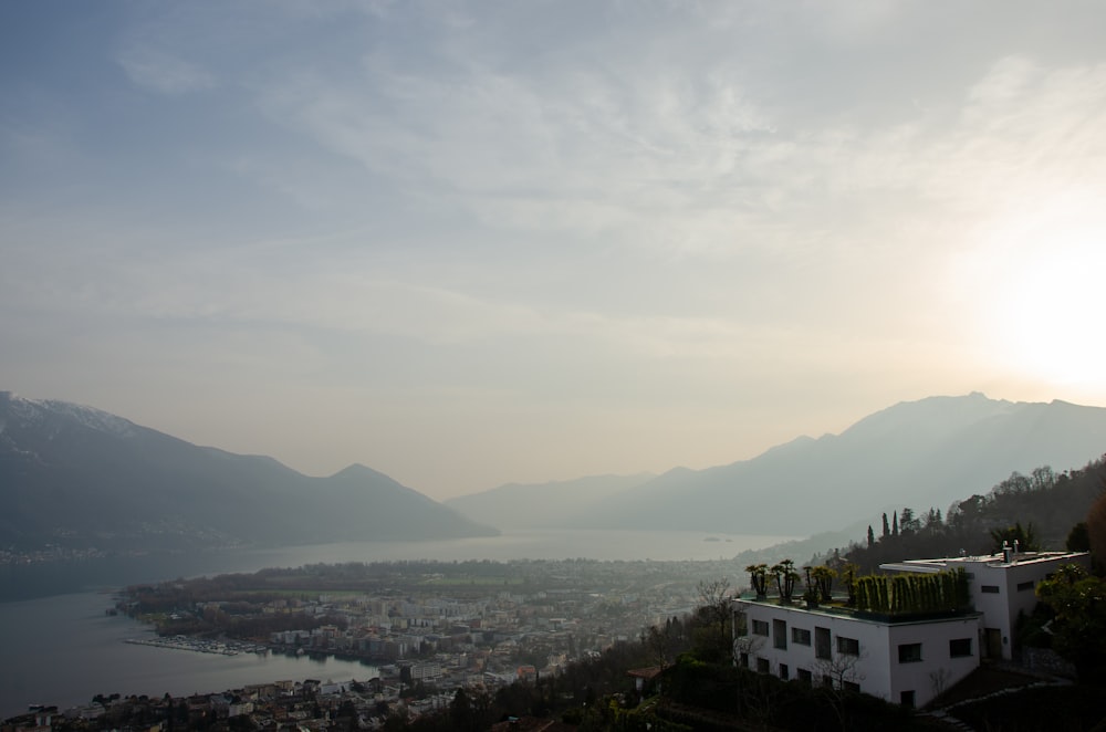 white concrete building near mountain during daytime