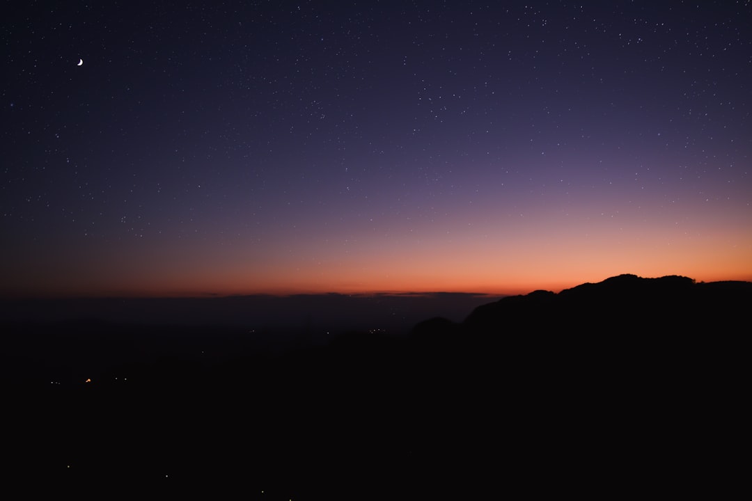 silhouette of mountain during sunset