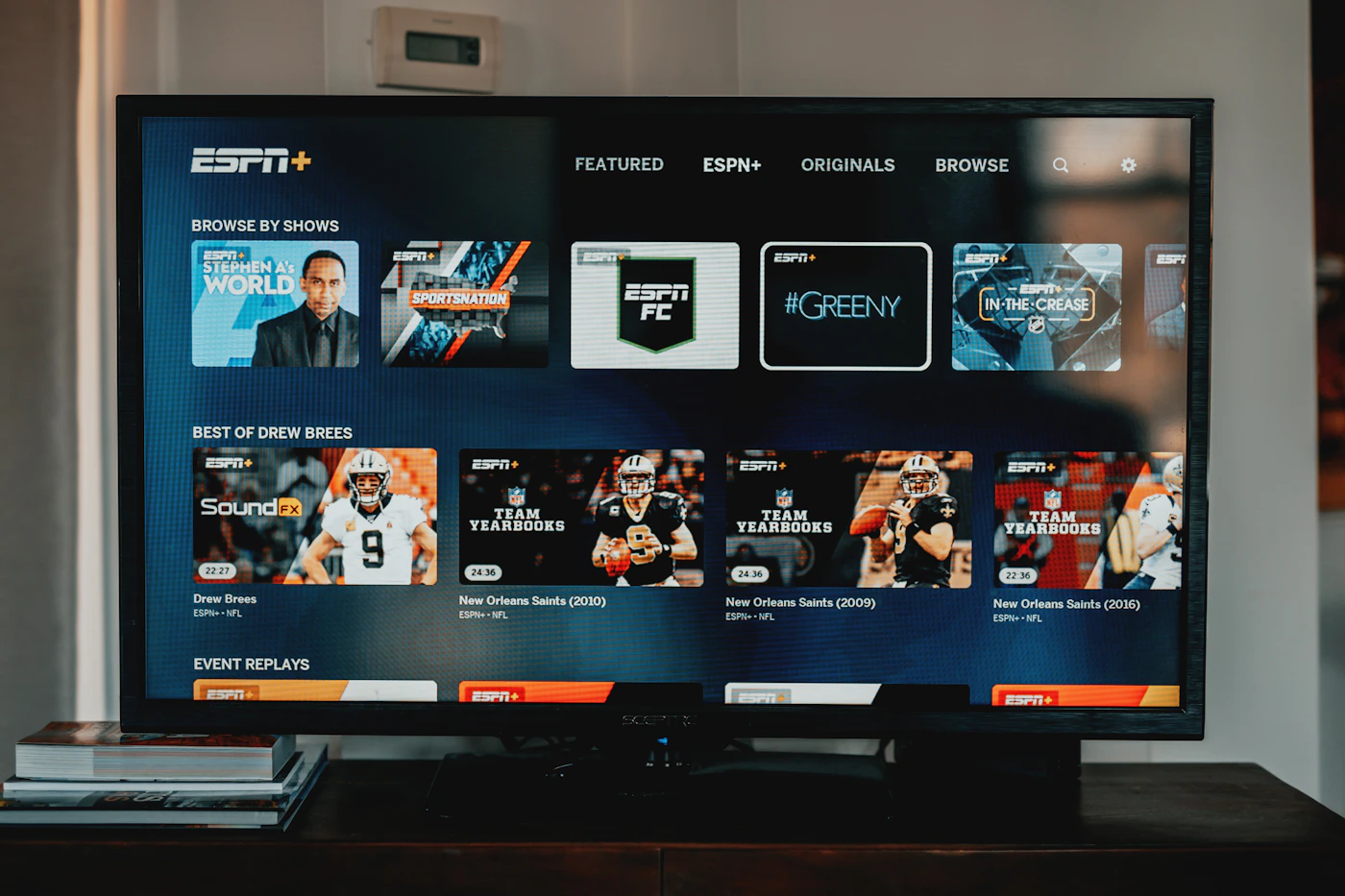 A flat screen TV on a wooden table
