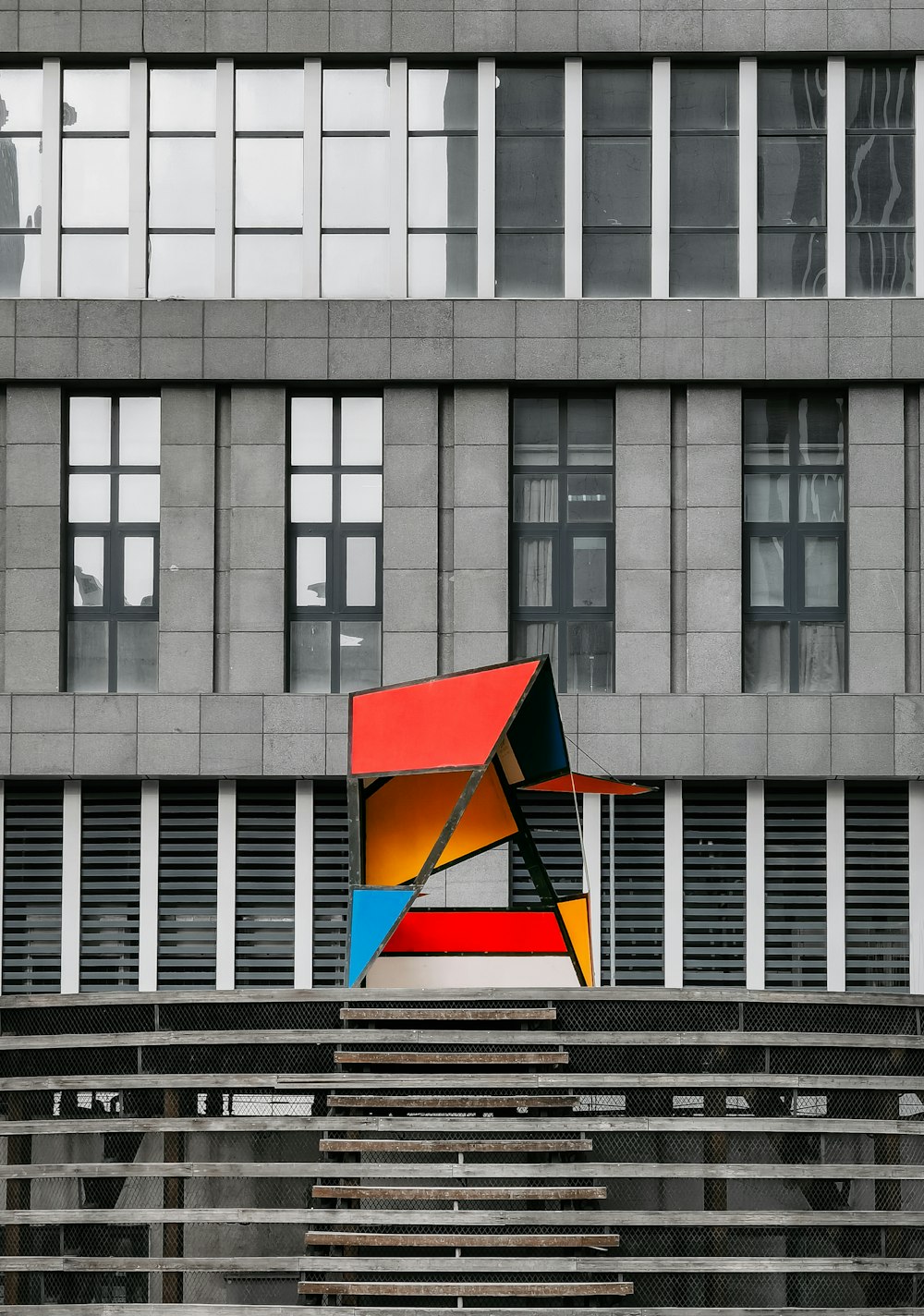 gray concrete building with glass windows