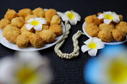 Close-up of traditional Berau food products styled elegantly on parchment paper.