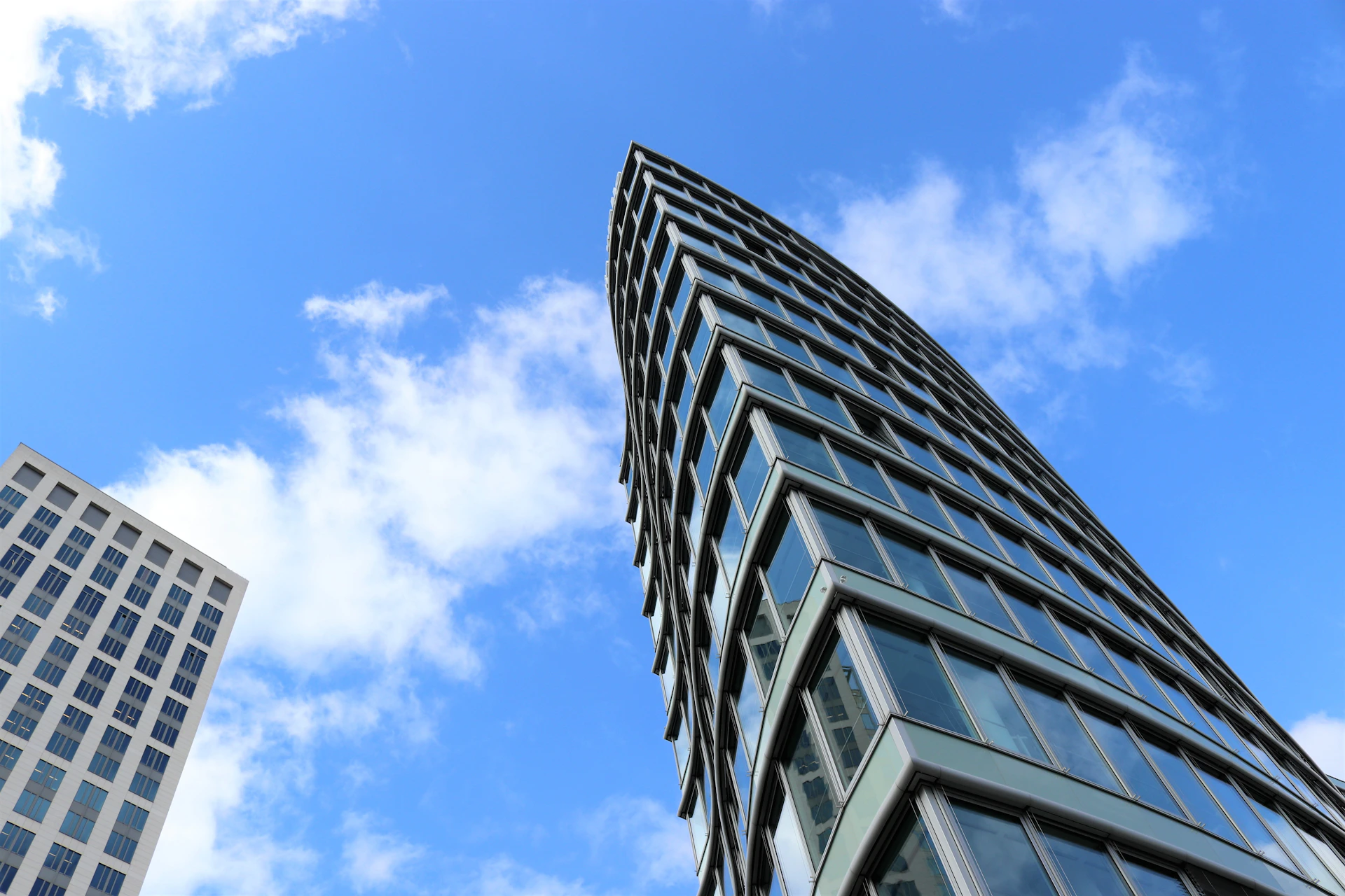 white and black concrete building under blue sky during daytime