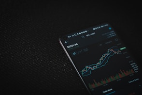 black android smartphone on black textile