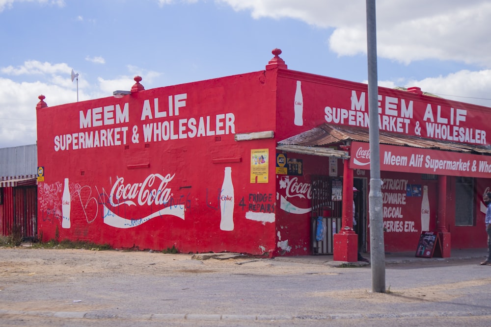 red and white coca cola signage