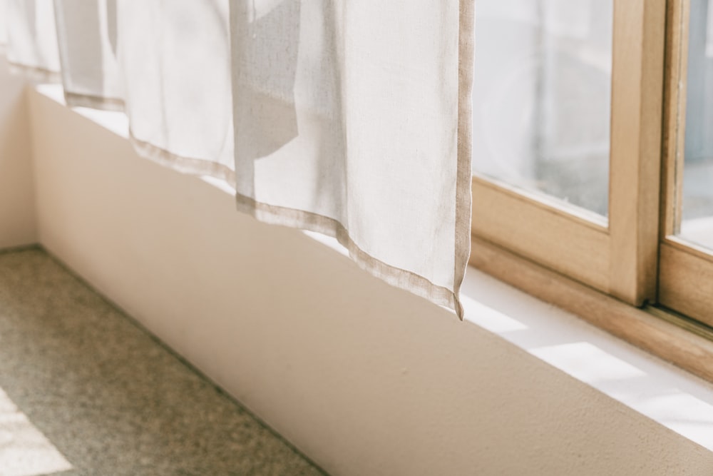 white window curtain on window