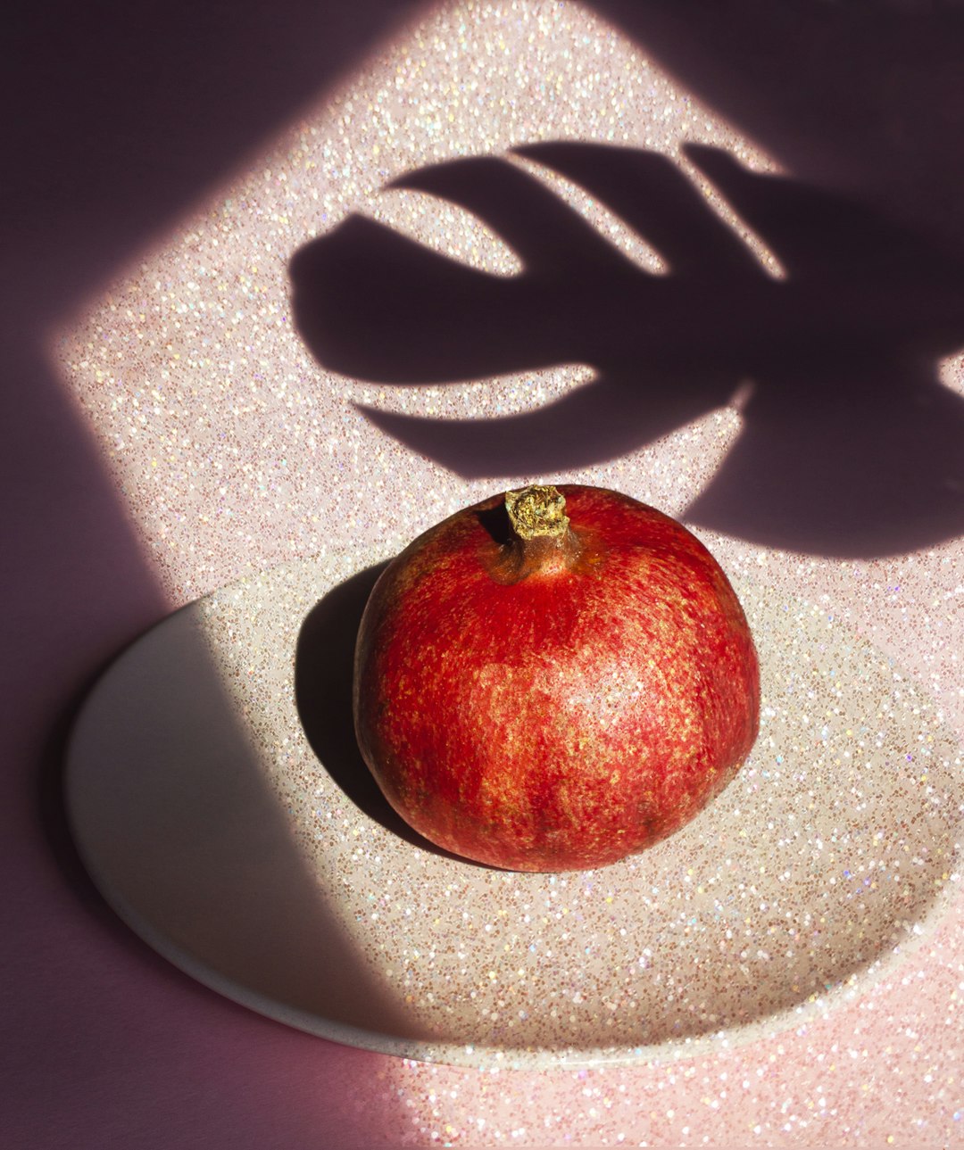 red apple fruit on white textile