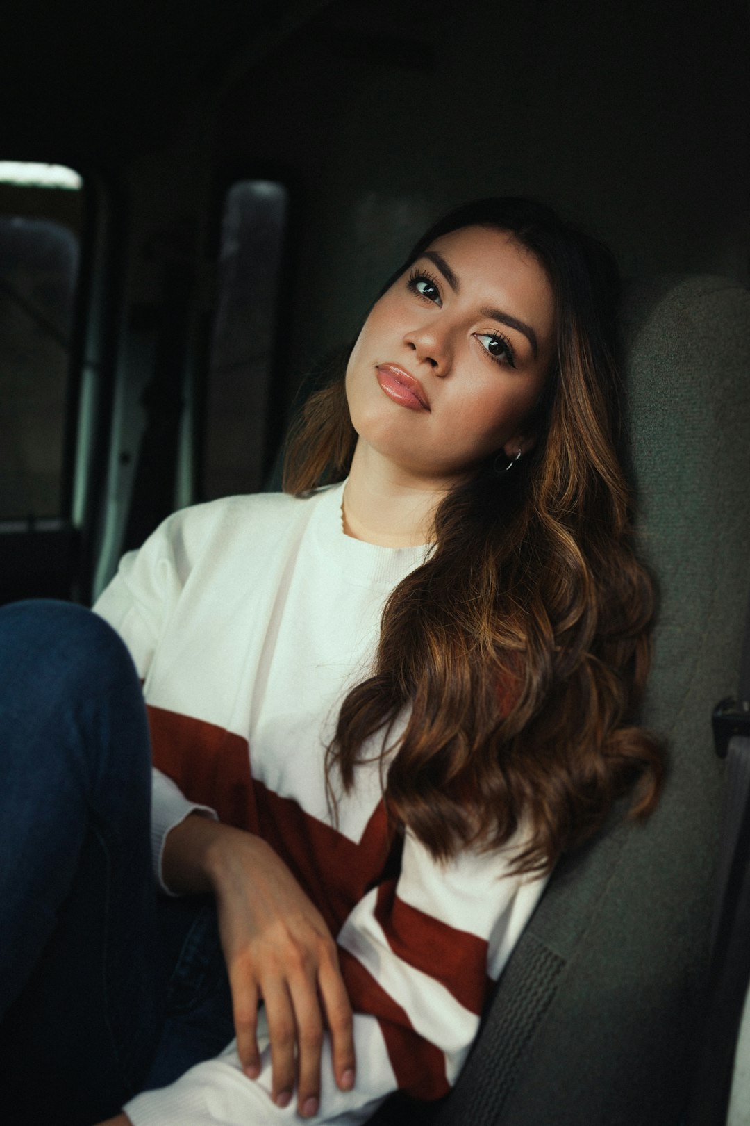 woman in white long sleeve shirt and blue denim jeans