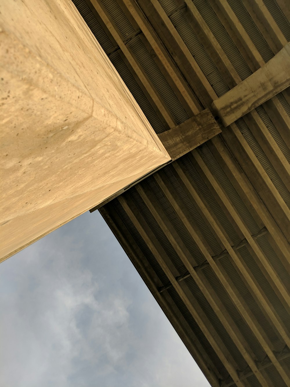 brown concrete building under blue sky during daytime