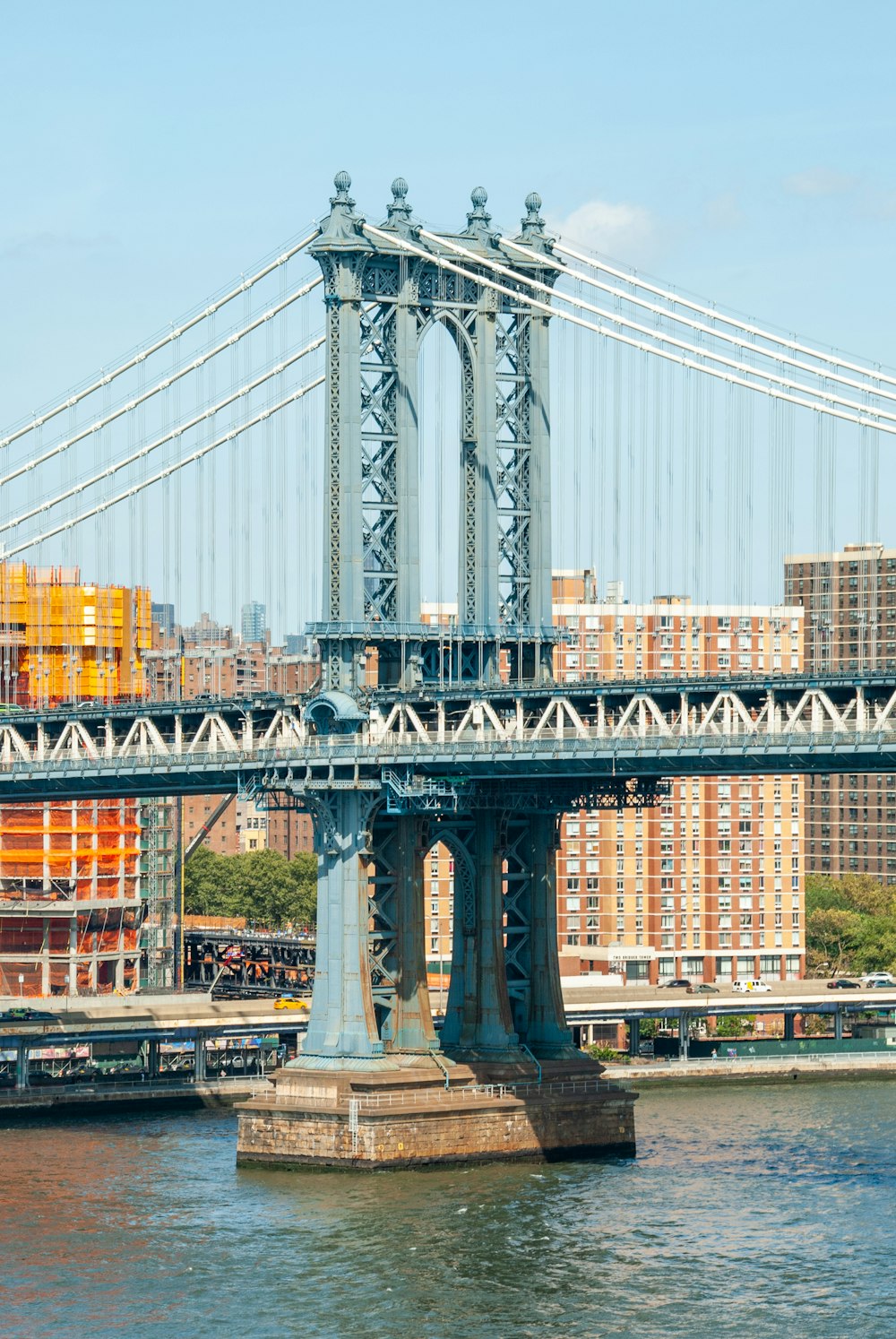 gray bridge over body of water during daytime