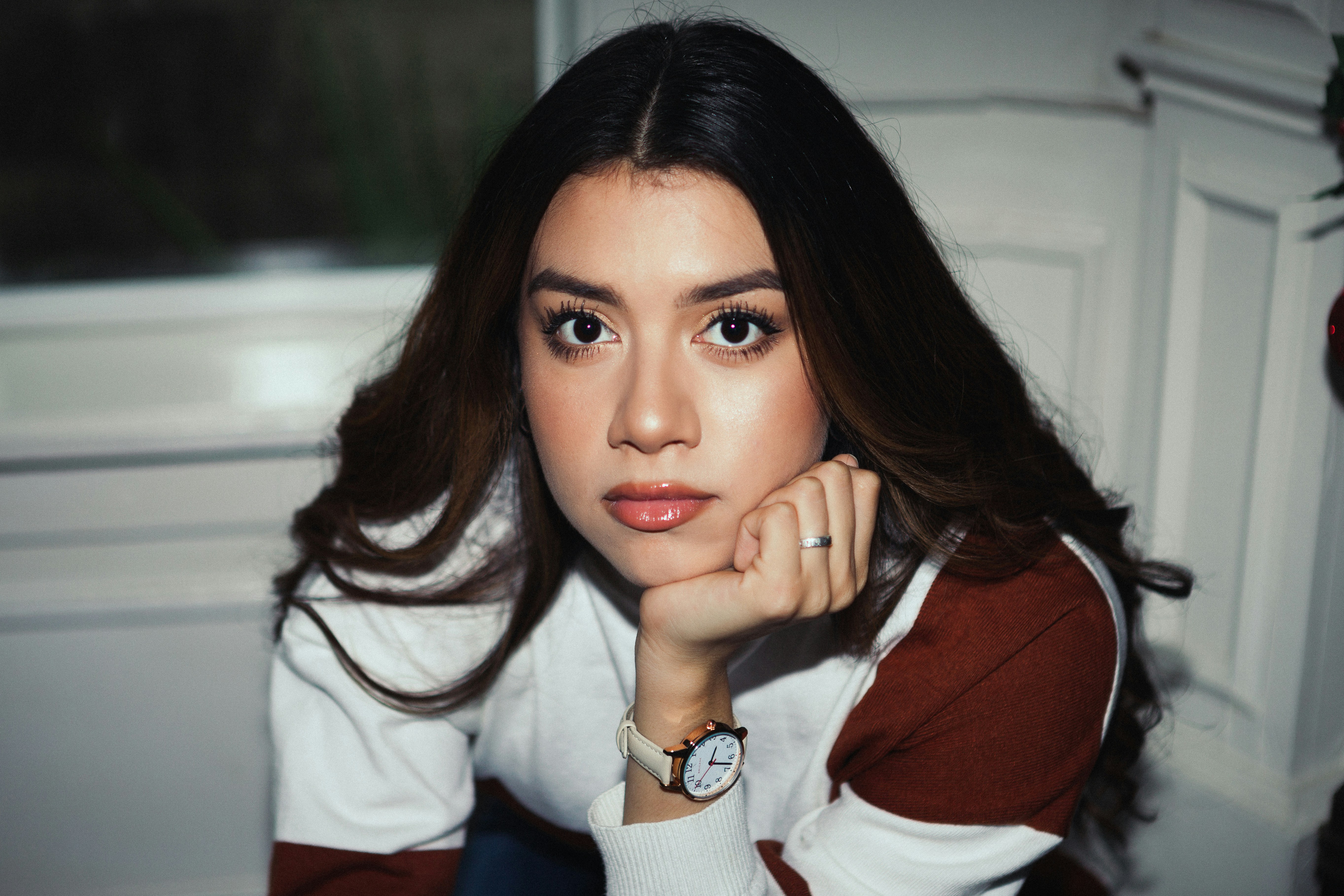 woman in red and white jacket