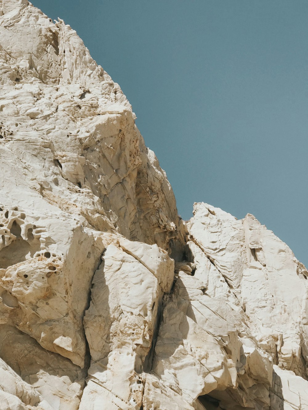 brown rocky mountain under blue sky during daytime