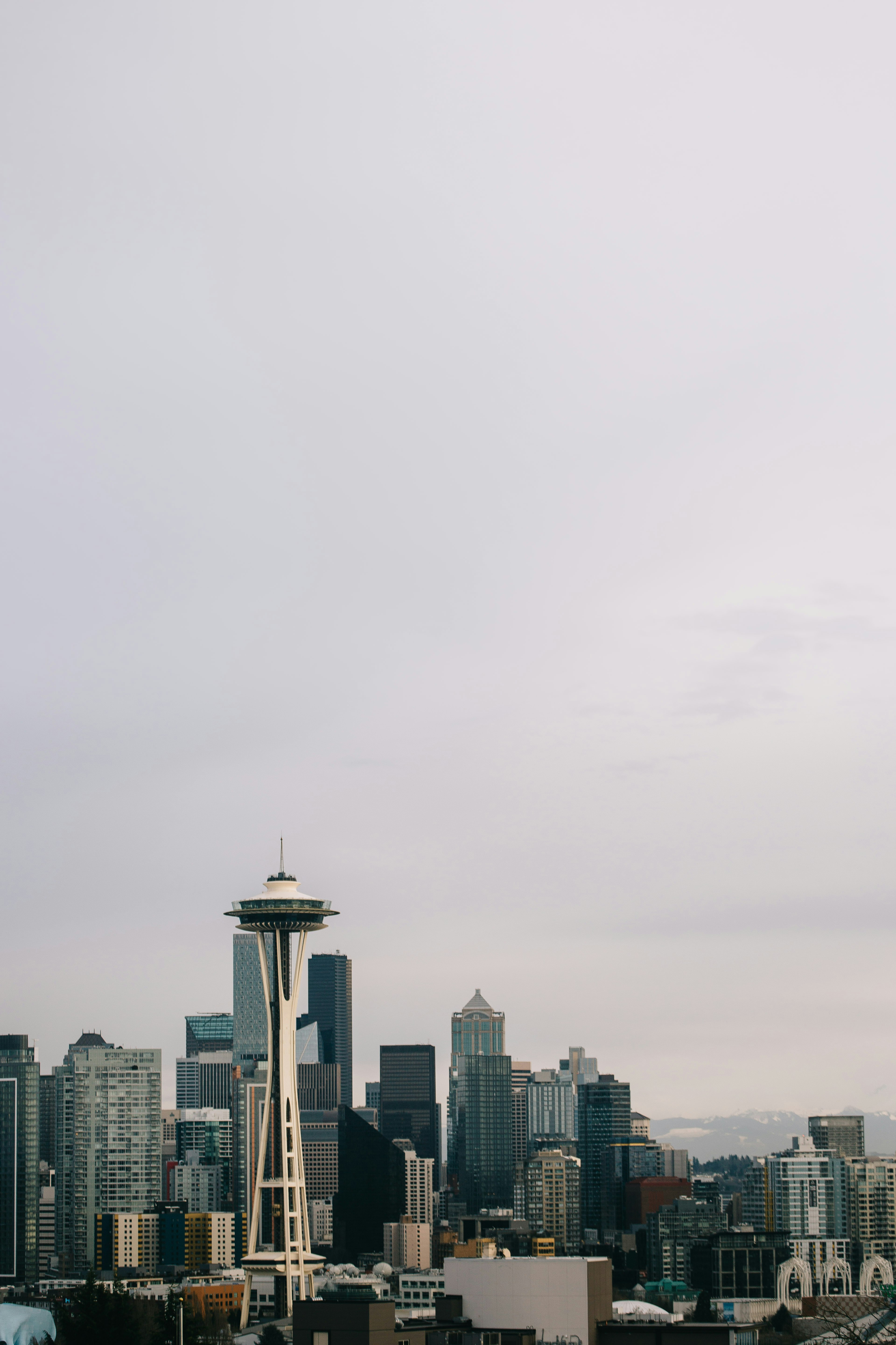 city skyline under white sky during daytime