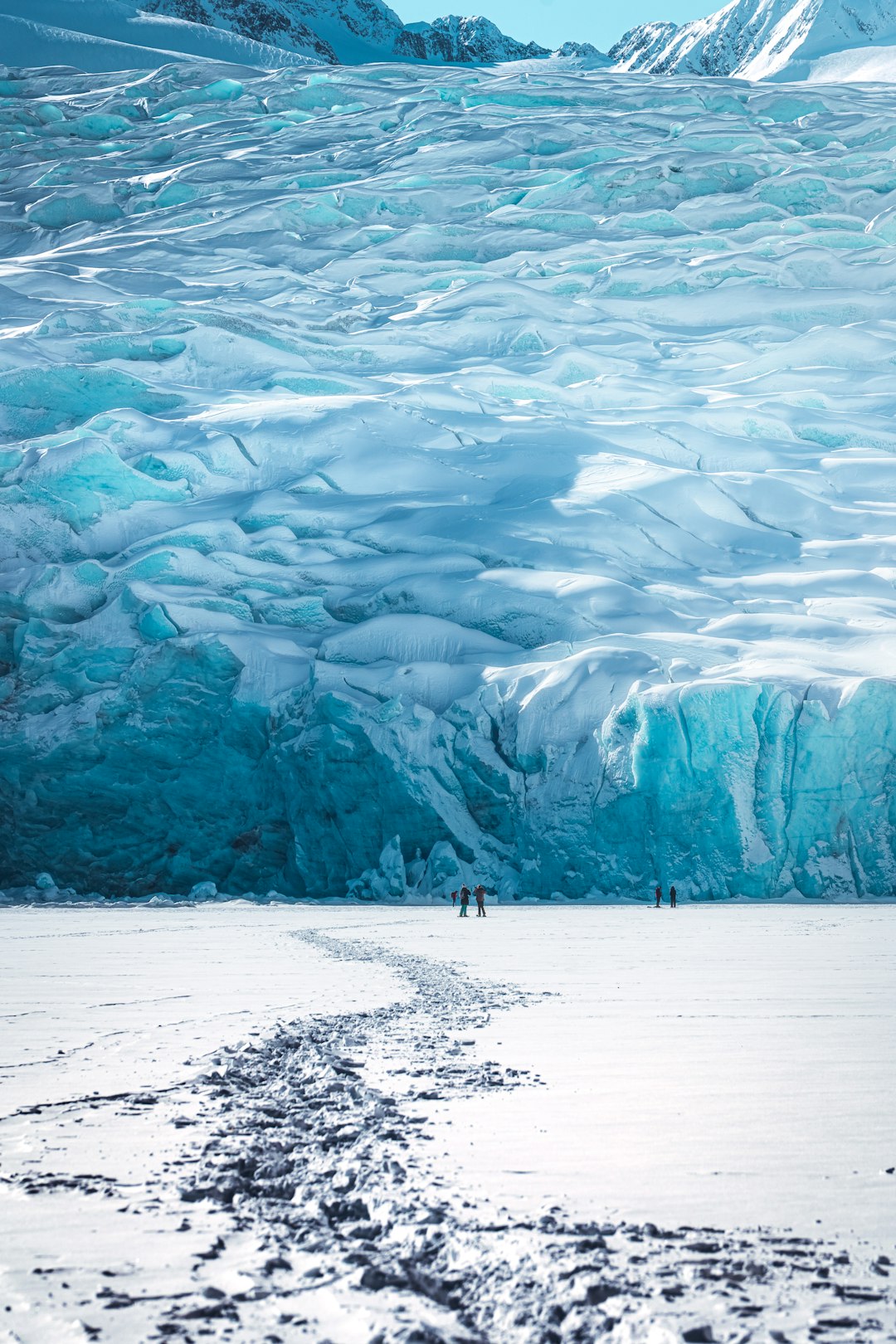 person standing on snow covered ground during daytime