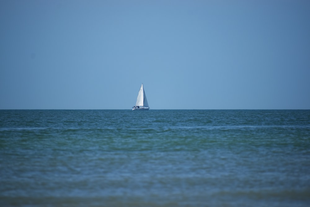 white sailboat on sea during daytime