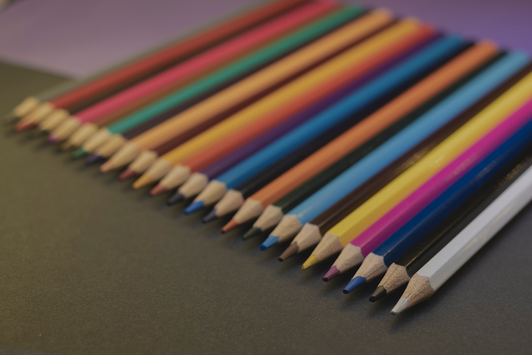 multi color coloring pencils on brown surface