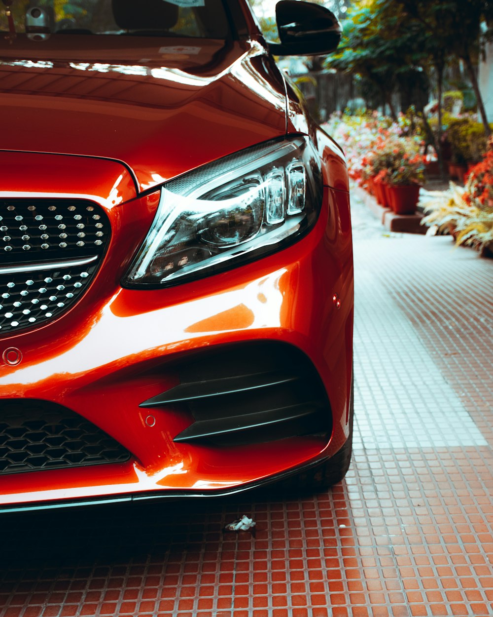 red car on gray pavement