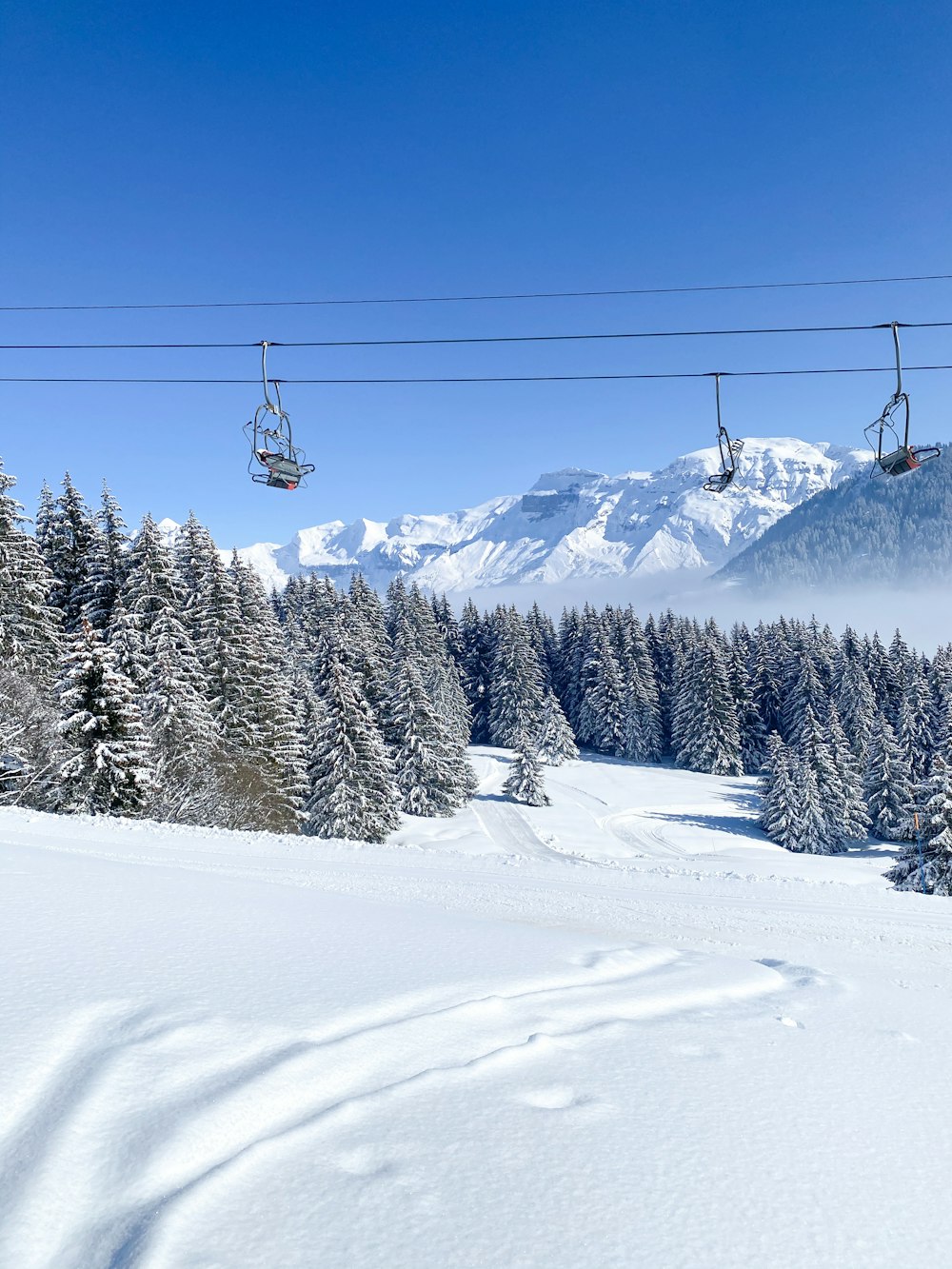 cable car over snow covered mountain