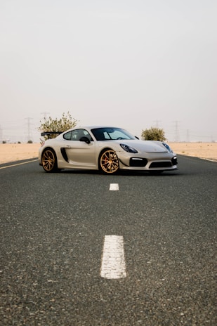 white and black bmw m 3 coupe on road during daytime