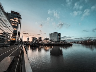 Evening cityscape view from office window with reflections of nile blue and grey goose tones.